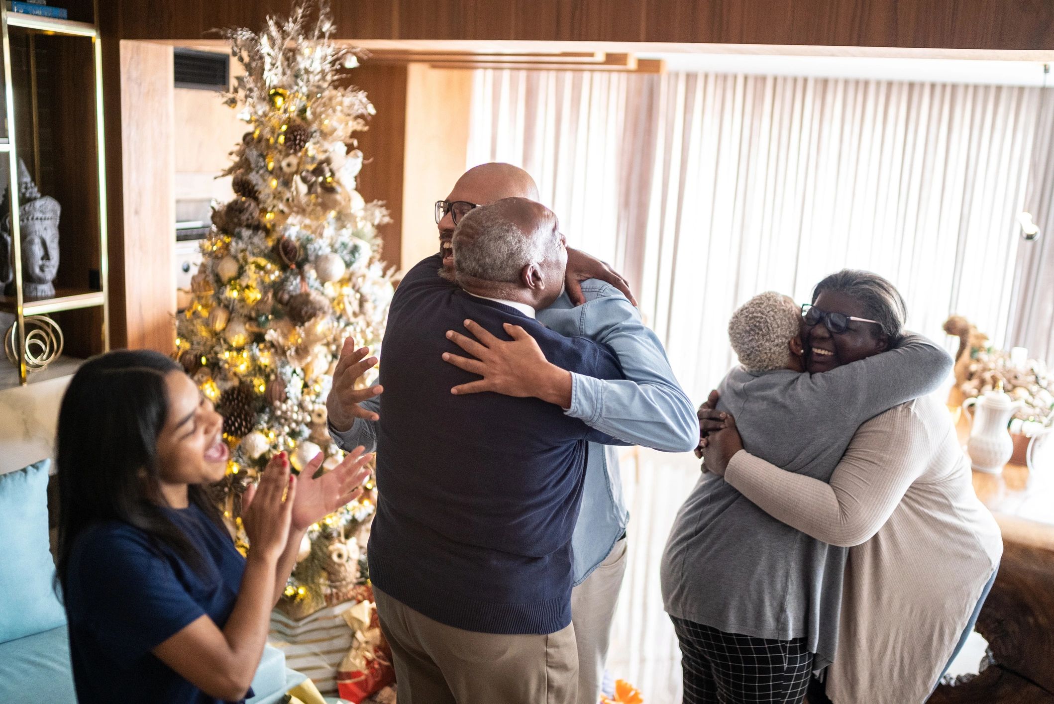 Family embracing during Christmas at home