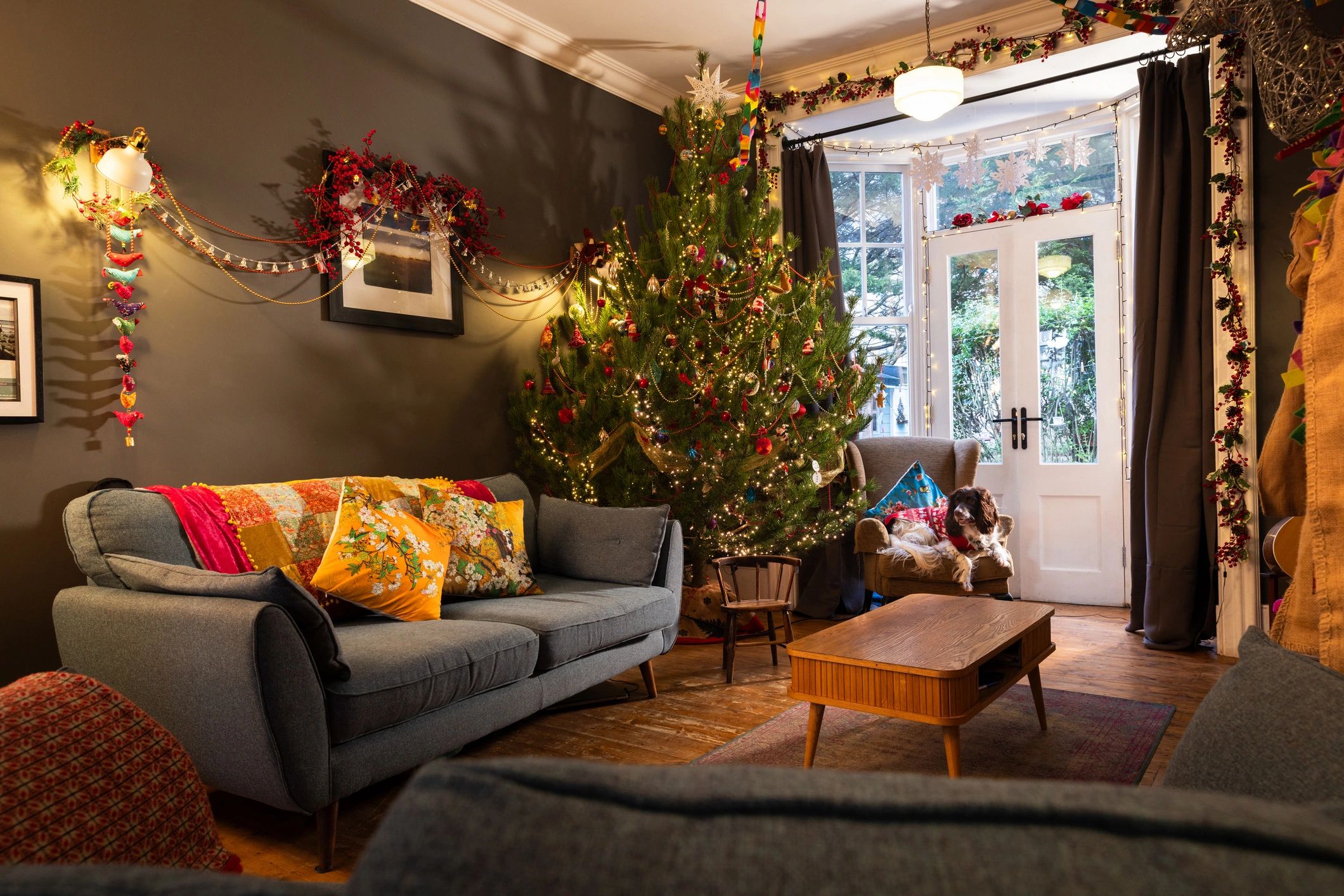 Cozy Christmas room glowing with tree lights